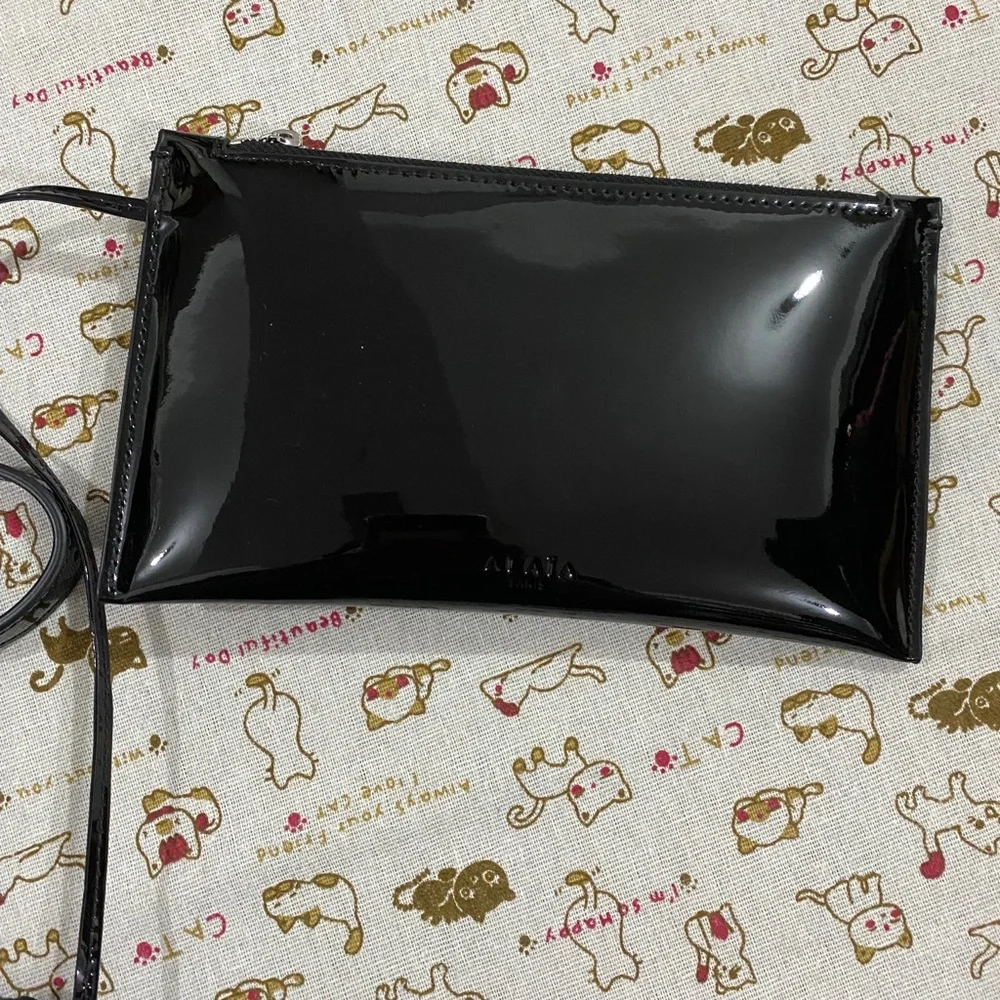 Alaïa Black Woven Crescent Shoulder Bag